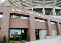 Front of Idaho Sports Medicine Institute. Red brick building under the Boise State University stadium.